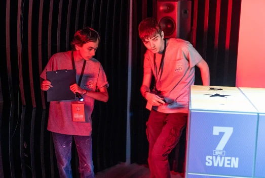 Players solving The Cube's puzzles during the finals