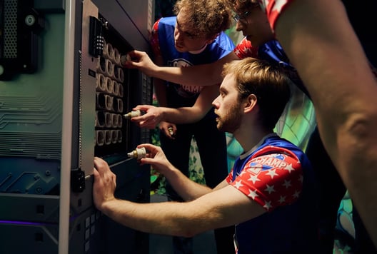 A team is solving a puzzle together during the Escape Room Championship.