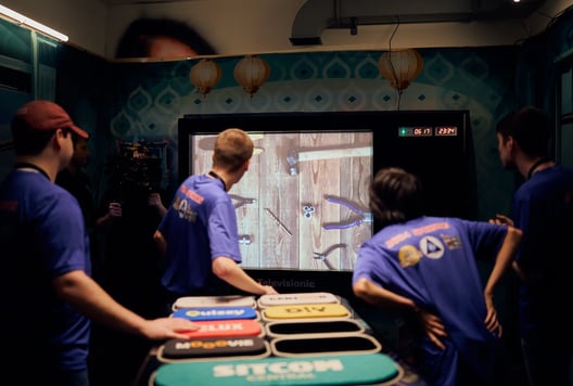 A team is looking at a screen with tools, trying to solve a puzzle together.